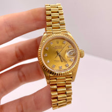 Load image into Gallery viewer, 26mm Women’s Presidential DateJust Rolex Watch With Champagne Diamond Dial In 18 KT Gold