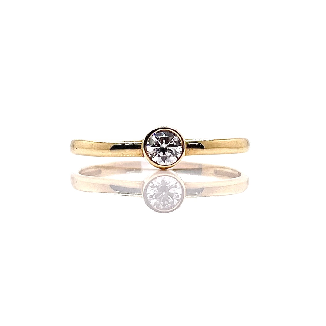 Bezel Set Women’s Dainty CZ Ring In 10 KT Yellow Gold